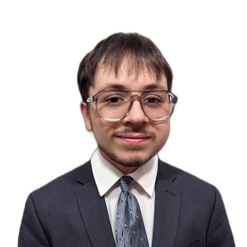 Headshot of Diego Gonzalez Alicata wearing a dark suit and glasses